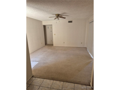 Easy access downstairs condo with patio view of pool and spa on Chaparral Golf and Country Club in Arizona - for sale on GolfHomes.com, golf home, golf lot