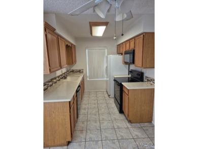 Easy access downstairs condo with patio view of pool and spa on Chaparral Golf and Country Club in Arizona - for sale on GolfHomes.com, golf home, golf lot