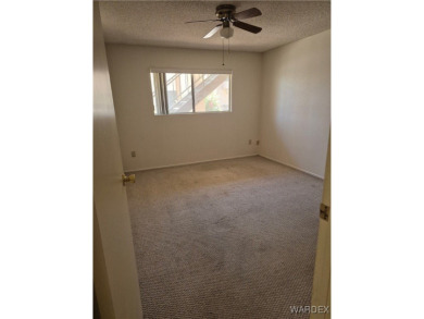 Easy access downstairs condo with patio view of pool and spa on Chaparral Golf and Country Club in Arizona - for sale on GolfHomes.com, golf home, golf lot