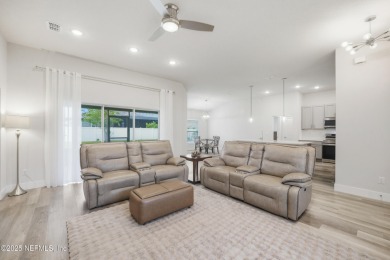 LIKE NEW! Welcome to this beautifully maintained 3-bedroom on The Grand Club Cypress Course in Florida - for sale on GolfHomes.com, golf home, golf lot