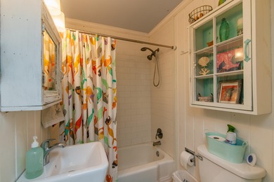 Charming and beautifully updated coastal cottage blending on The Plantation Course At Edisto in South Carolina - for sale on GolfHomes.com, golf home, golf lot