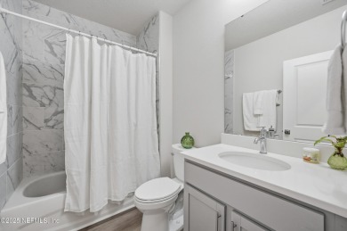 LIKE NEW! Welcome to this beautifully maintained 3-bedroom on The Grand Club Cypress Course in Florida - for sale on GolfHomes.com, golf home, golf lot