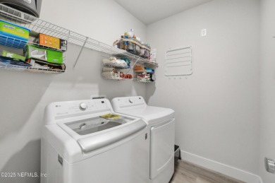 LIKE NEW! Welcome to this beautifully maintained 3-bedroom on The Grand Club Cypress Course in Florida - for sale on GolfHomes.com, golf home, golf lot