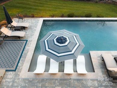 Discover refined lakeside living in this custom home completed on Mallard Head Country Club in North Carolina - for sale on GolfHomes.com, golf home, golf lot