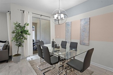 Discover the perfect blend of comfort, style, and location at on The Oasis Club at Champions Gate in Florida - for sale on GolfHomes.com, golf home, golf lot