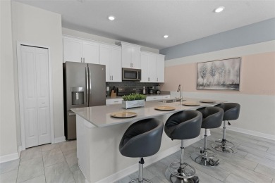 Discover the perfect blend of comfort, style, and location at on The Oasis Club at Champions Gate in Florida - for sale on GolfHomes.com, golf home, golf lot
