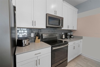 Discover the perfect blend of comfort, style, and location at on The Oasis Club at Champions Gate in Florida - for sale on GolfHomes.com, golf home, golf lot