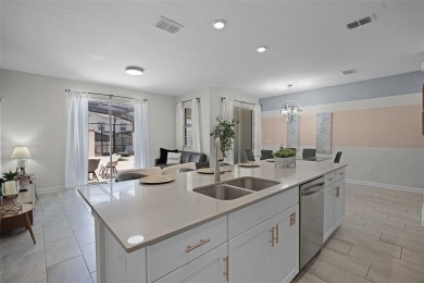 Discover the perfect blend of comfort, style, and location at on The Oasis Club at Champions Gate in Florida - for sale on GolfHomes.com, golf home, golf lot