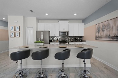 Discover the perfect blend of comfort, style, and location at on The Oasis Club at Champions Gate in Florida - for sale on GolfHomes.com, golf home, golf lot