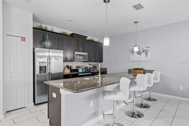 Step into the ultimate vacation lifestyle at 1578 Slice Way, a on The Oasis Club at Champions Gate in Florida - for sale on GolfHomes.com, golf home, golf lot