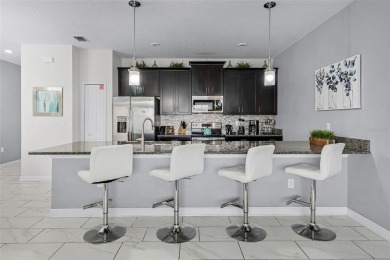 Step into the ultimate vacation lifestyle at 1578 Slice Way, a on The Oasis Club at Champions Gate in Florida - for sale on GolfHomes.com, golf home, golf lot