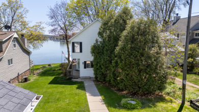 Dock your dreams on Big Cedar Lake! on West Bend Country Club in Wisconsin - for sale on GolfHomes.com, golf home, golf lot