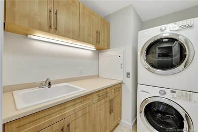 This stunning two-story custom-built home offers breathtaking on Island Dunes Country Club in Florida - for sale on GolfHomes.com, golf home, golf lot