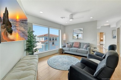 This stunning two-story custom-built home offers breathtaking on Island Dunes Country Club in Florida - for sale on GolfHomes.com, golf home, golf lot