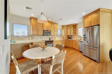 This stunning two-story custom-built home offers breathtaking on Island Dunes Country Club in Florida - for sale on GolfHomes.com, golf home, golf lot