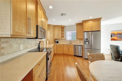 This stunning two-story custom-built home offers breathtaking on Island Dunes Country Club in Florida - for sale on GolfHomes.com, golf home, golf lot