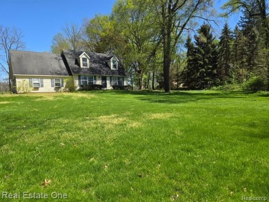 WOW! Don't miss this 1-ACRE Property with Cape Cod style home on The Medalist Golf Club in Michigan - for sale on GolfHomes.com, golf home, golf lot