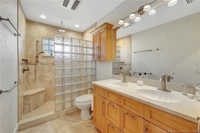 This stunning two-story custom-built home offers breathtaking on Island Dunes Country Club in Florida - for sale on GolfHomes.com, golf home, golf lot