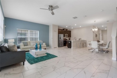 Get ready to fall in love with this fully furnished 5-bedroom on The Oasis Club at Champions Gate in Florida - for sale on GolfHomes.com, golf home, golf lot