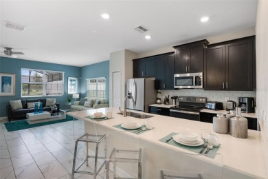 Get ready to fall in love with this fully furnished 5-bedroom on The Oasis Club at Champions Gate in Florida - for sale on GolfHomes.com, golf home, golf lot