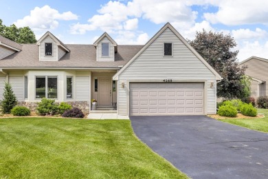 CONTEMPORARY SUMMIT TOWNSHIP END-UNIT CONDO FEATURING MAIN FLOOR on Country Club of Jackson in Michigan - for sale on GolfHomes.com, golf home, golf lot
