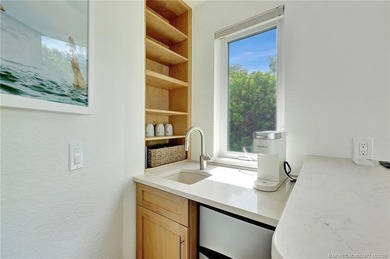 This stunning two-story custom-built home offers breathtaking on Island Dunes Country Club in Florida - for sale on GolfHomes.com, golf home, golf lot