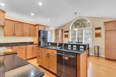 CONTEMPORARY SUMMIT TOWNSHIP END-UNIT CONDO FEATURING MAIN FLOOR on Country Club of Jackson in Michigan - for sale on GolfHomes.com, golf home, golf lot