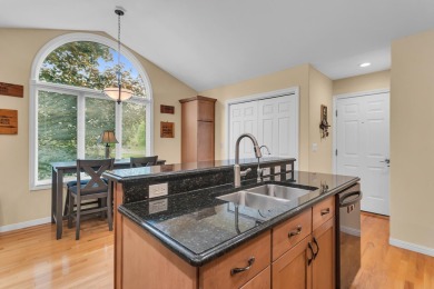 CONTEMPORARY SUMMIT TOWNSHIP END-UNIT CONDO FEATURING MAIN FLOOR on Country Club of Jackson in Michigan - for sale on GolfHomes.com, golf home, golf lot