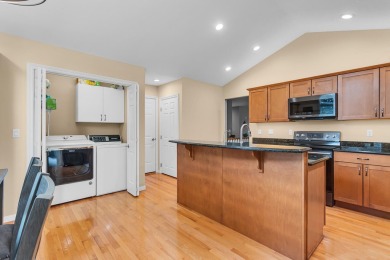 CONTEMPORARY SUMMIT TOWNSHIP END-UNIT CONDO FEATURING MAIN FLOOR on Country Club of Jackson in Michigan - for sale on GolfHomes.com, golf home, golf lot