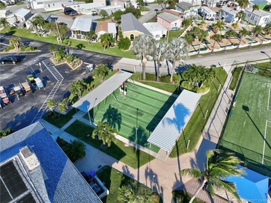 This stunning two-story custom-built home offers breathtaking on Island Dunes Country Club in Florida - for sale on GolfHomes.com, golf home, golf lot