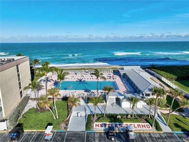 This stunning two-story custom-built home offers breathtaking on Island Dunes Country Club in Florida - for sale on GolfHomes.com, golf home, golf lot