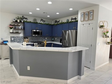 Enjoy your morning coffee from this beautiful courtyard on the on Aliante Golf Club in Nevada - for sale on GolfHomes.com, golf home, golf lot