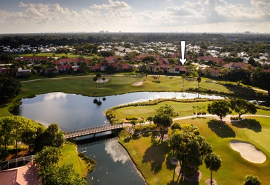 Set along the picturesque fairways of PGA National, this on PGA National Golf Club in Florida - for sale on GolfHomes.com, golf home, golf lot