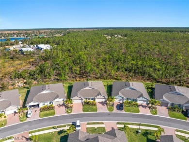 This coastal contemporary home with private preserve view will on Herons Glen Golf and Country Club in Florida - for sale on GolfHomes.com, golf home, golf lot