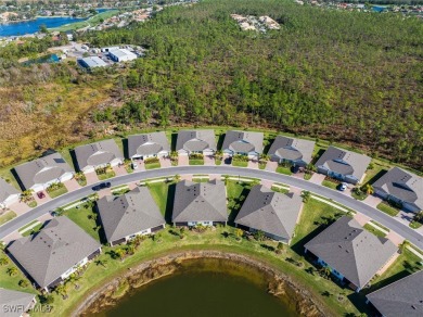 This coastal contemporary home with private preserve view will on Herons Glen Golf and Country Club in Florida - for sale on GolfHomes.com, golf home, golf lot