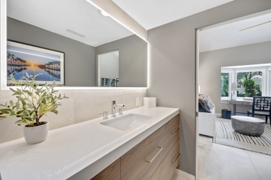 This renovated lakefront home offers comfort, style, and serene on Ocean Reef Club in Florida - for sale on GolfHomes.com, golf home, golf lot