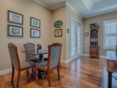 LOVELY CUSTOM EXPANDED WILLIAMSBURG PREMIER home with over 3000 on Palmer Legends Country Club in Florida - for sale on GolfHomes.com, golf home, golf lot
