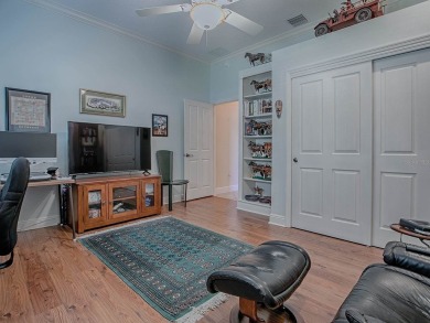LOVELY CUSTOM EXPANDED WILLIAMSBURG PREMIER home with over 3000 on Palmer Legends Country Club in Florida - for sale on GolfHomes.com, golf home, golf lot