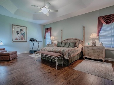 LOVELY CUSTOM EXPANDED WILLIAMSBURG PREMIER home with over 3000 on Palmer Legends Country Club in Florida - for sale on GolfHomes.com, golf home, golf lot