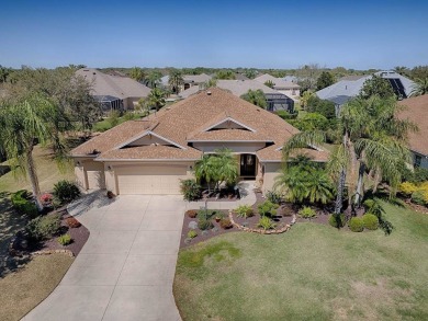 LOVELY CUSTOM EXPANDED WILLIAMSBURG PREMIER home with over 3000 on Palmer Legends Country Club in Florida - for sale on GolfHomes.com, golf home, golf lot