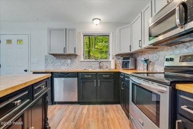 Fully remodeled 4-Bedroom Home in Tanglwood Lakes with Lake on Paupack Hills Golf and Country Club in Pennsylvania - for sale on GolfHomes.com, golf home, golf lot