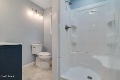 Fully remodeled 4-Bedroom Home in Tanglwood Lakes with Lake on Paupack Hills Golf and Country Club in Pennsylvania - for sale on GolfHomes.com, golf home, golf lot