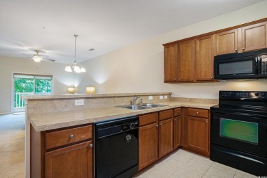 This is a beautifully maintained 2-bedroom, 2-bathroom condo on Barefoot Resort and Golf Club  in South Carolina - for sale on GolfHomes.com, golf home, golf lot