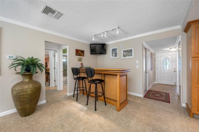 This updated home offers one of the most stunning views in all on Highland Lakes Executive Golf Course in Florida - for sale on GolfHomes.com, golf home, golf lot