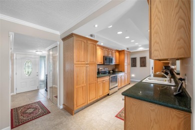 This updated home offers one of the most stunning views in all on Highland Lakes Executive Golf Course in Florida - for sale on GolfHomes.com, golf home, golf lot