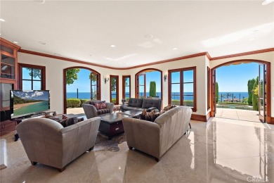 Indulge in elegant coastal living at this opulent ocean-view on Pelican Hill Golf Club in California - for sale on GolfHomes.com, golf home, golf lot