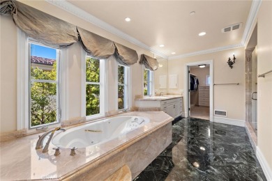 Indulge in elegant coastal living at this opulent ocean-view on Pelican Hill Golf Club in California - for sale on GolfHomes.com, golf home, golf lot