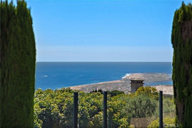 Indulge in elegant coastal living at this opulent ocean-view on Pelican Hill Golf Club in California - for sale on GolfHomes.com, golf home, golf lot