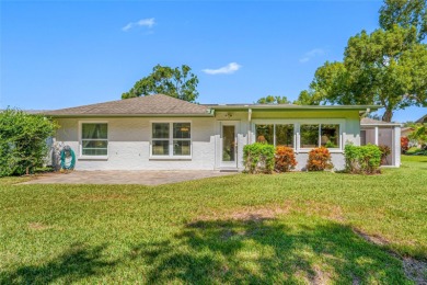 This updated home offers one of the most stunning views in all on Highland Lakes Executive Golf Course in Florida - for sale on GolfHomes.com, golf home, golf lot