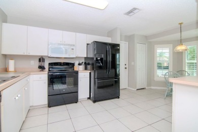 NEW PRICE! This stunning two bedroom, two bath home with a DEN on Caloosa Greens Executive Golf Course in Florida - for sale on GolfHomes.com, golf home, golf lot